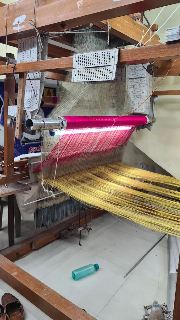 Silk warp threads set on a traditional wooden pit loom